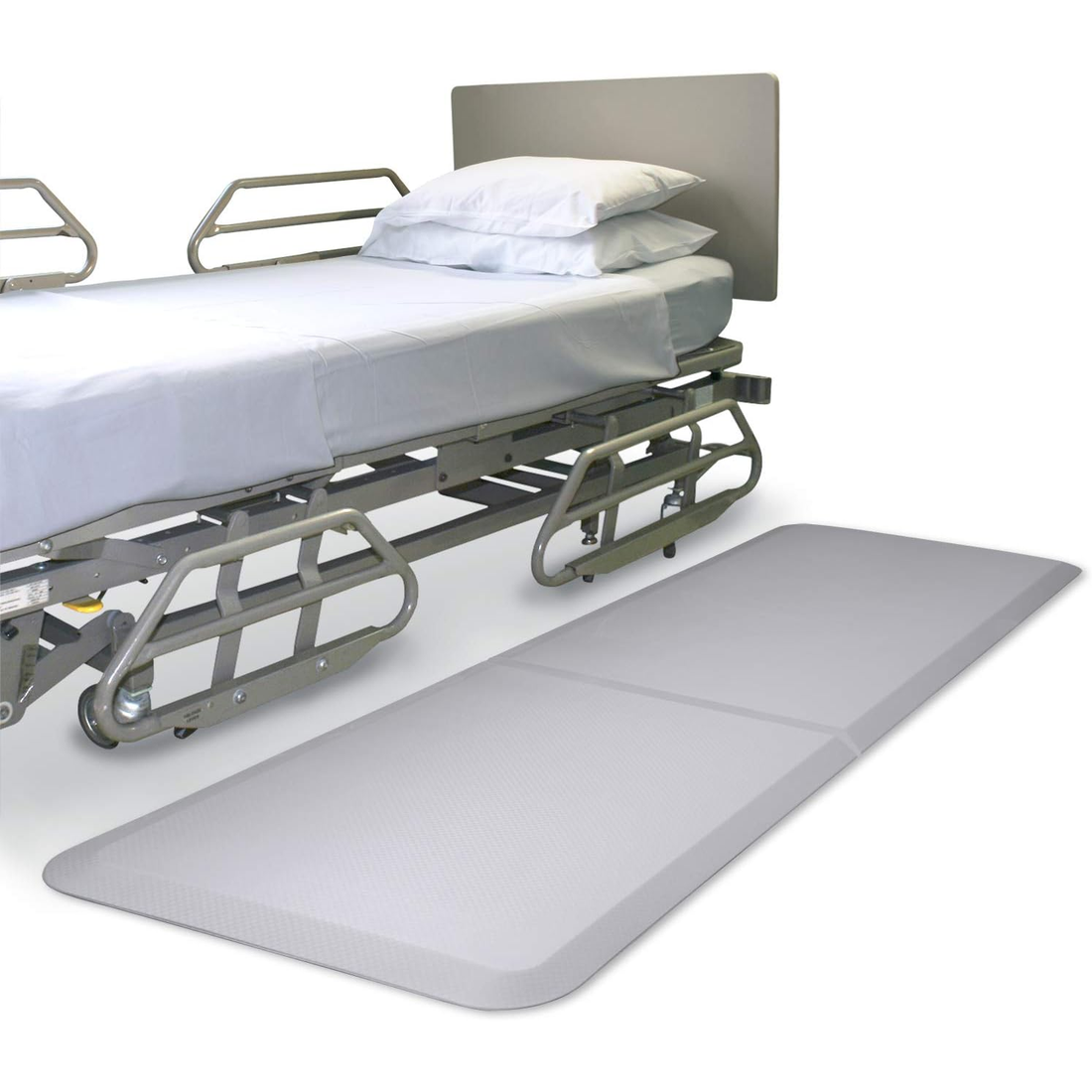 Hospital bed with a large mat in front on a white background